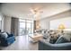 Inviting living room with plush seating, a ceiling fan, and access to a balcony with ocean views at 1903 S Ocean Blvd. # 1110, North Myrtle Beach, SC 29582