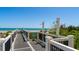 Outdoor shower area with walkway access and view of the beach at 1903 S Ocean Blvd. # 1110, North Myrtle Beach, SC 29582