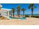 Community pool with a lazy river and palm tree landscaping at 1903 S Ocean Blvd. # 1110, North Myrtle Beach, SC 29582