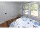 Bright bedroom featuring a twin bed with nautical bedding, wood floors, and a window at 1931 Lakeview Circle, Surfside Beach, SC 29575