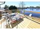 Deck with chairs and table overlooking waterfront at 1931 Lakeview Circle, Surfside Beach, SC 29575