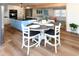 Open-concept dining area with stylish table connected to the modern kitchen at 1931 Lakeview Circle, Surfside Beach, SC 29575