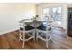 Cozy dining area with a view and a stylish table set for four at 1931 Lakeview Circle, Surfside Beach, SC 29575