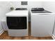 Bright laundry room with modern side-by-side washer and dryer at 1931 Lakeview Circle, Surfside Beach, SC 29575