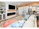 Open-concept living room with a fireplace, TV, and cozy seating area at 1931 Lakeview Circle, Surfside Beach, SC 29575