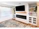 Modern living room with a fireplace, built-in shelves, and stylish decor at 1931 Lakeview Circle, Surfside Beach, SC 29575