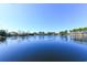 Calm lake view with a row of houses along the shoreline, creating a peaceful and picturesque waterfront scenery at 1931 Lakeview Circle, Surfside Beach, SC 29575