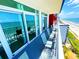 Wide balcony with seating overlooks the ocean and sandy beach at 2007 S Ocean Blvd. # 1506, Myrtle Beach, SC 29577