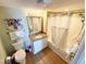 Clean and bright bathroom features a vanity and a shower-tub combo with a shower curtain at 2007 S Ocean Blvd. # 1506, Myrtle Beach, SC 29577