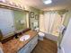 Bathroom with a granite-topped vanity, framed mirror, toilet, and shower-tub combo at 2007 S Ocean Blvd. # 1506, Myrtle Beach, SC 29577