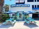 Mini Mart & Gifts store exterior with shaded seating area at 2007 S Ocean Blvd. # 1506, Myrtle Beach, SC 29577