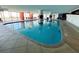 Bright indoor pool area with floor-to-ceiling windows that allow ocean views at 2007 S Ocean Blvd. # 1506, Myrtle Beach, SC 29577