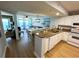 Inviting kitchen flows into a combined living and dining area with scenic ocean views at 2007 S Ocean Blvd. # 1506, Myrtle Beach, SC 29577