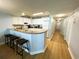Eat-in kitchen with breakfast bar and white cabinets at 2007 S Ocean Blvd. # 1506, Myrtle Beach, SC 29577