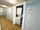 Hallway laundry closet with a stacked washer and dryer unit for convenient laundry access at 2007 S Ocean Blvd. # 1506, Myrtle Beach, SC 29577