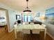 Living and dining area features a modern table, comfortable seating, and scenic views at 2007 S Ocean Blvd. # 1506, Myrtle Beach, SC 29577