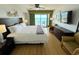 Comfortable bedroom with ocean views from the sliding glass doors onto the balcony at 2007 S Ocean Blvd. # 1506, Myrtle Beach, SC 29577