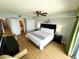 Comfortable bedroom leads to en suite bathroom, closet, and sliding glass doors to the balcony at 2007 S Ocean Blvd. # 1506, Myrtle Beach, SC 29577