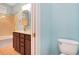 Bathroom with a double vanity, a tub with shower, and a separate toilet area at 210 Natures View Circle, Pawleys Island, SC 29585