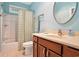 Full bathroom features a shower-tub combo, wood vanity, and neutral tiling at 210 Natures View Circle, Pawleys Island, SC 29585