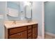 Bathroom features a double sink vanity with dark wood cabinetry and neutral countertop at 210 Natures View Circle, Pawleys Island, SC 29585