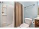 Full bathroom featuring shower-tub combo, light blue walls, and tile flooring at 210 Natures View Circle, Pawleys Island, SC 29585