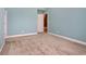 Bright bedroom featuring neutral carpet, and a connecting door at 210 Natures View Circle, Pawleys Island, SC 29585