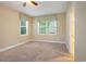 Comfortable bedroom featuring neutral walls, carpeted floor and windows at 210 Natures View Circle, Pawleys Island, SC 29585