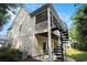 Back of home with a screened porch and a spiral staircase at 210 Natures View Circle, Pawleys Island, SC 29585
