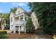 Charming home with a covered front porch and well-maintained landscaping at 210 Natures View Circle, Pawleys Island, SC 29585