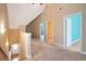 Second floor loft with carpeted floors and access to multiple bedrooms at 210 Natures View Circle, Pawleys Island, SC 29585