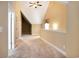 Second floor loft with carpeted floors and high vaulted ceilings at 210 Natures View Circle, Pawleys Island, SC 29585