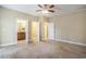 Spacious main bedroom featuring multiple closets, doorways and carpeted floors at 210 Natures View Circle, Pawleys Island, SC 29585