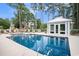 Community pool with a pool house and lounge chairs at 210 Natures View Circle, Pawleys Island, SC 29585