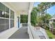 Inviting front porch with a view of the surrounding landscape at 210 Natures View Circle, Pawleys Island, SC 29585