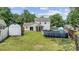 A spacious backyard with a storage shed, small above-ground pool, a fenced yard, and a partial view of the back of the house at 216 Deer Trace Circle, Myrtle Beach, SC 29588