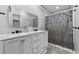 Bathroom featuring a vanity with double sinks, gray cabinets, and a shower with curtain at 216 Deer Trace Circle, Myrtle Beach, SC 29588