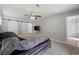 Bedroom featuring a bed, carpet flooring, and barn doors to the bathroom at 216 Deer Trace Circle, Myrtle Beach, SC 29588