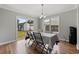 Bright dining area with wood floors, chandelier lighting and sliding door access to outdoor area at 216 Deer Trace Circle, Myrtle Beach, SC 29588