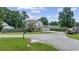 Charming two-story home featuring a well-manicured lawn, attached garage, and a welcoming covered front porch at 216 Deer Trace Circle, Myrtle Beach, SC 29588