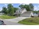 Beautiful two-story home featuring a well-manicured lawn, attached garage, and a welcoming covered front porch at 216 Deer Trace Circle, Myrtle Beach, SC 29588