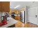 Bright and well-equipped kitchen featuring wood cabinets, stainless steel appliances, and hardwood floors at 216 Deer Trace Circle, Myrtle Beach, SC 29588
