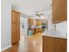 Eat-in kitchen featuring wooden cabinets, stainless steel appliances, and hardwood floors at 216 Deer Trace Circle, Myrtle Beach, SC 29588