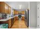 Spacious kitchen with wood cabinetry, stainless steel appliances, and hardwood floors at 216 Deer Trace Circle, Myrtle Beach, SC 29588