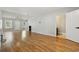 Bright living room with gleaming hardwood floors, recessed lighting, and an open doorway to the half bath at 216 Deer Trace Circle, Myrtle Beach, SC 29588