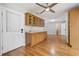 Entertain in this spacious living room featuring wood floors, custom cabinetry and a wet bar at 216 Deer Trace Circle, Myrtle Beach, SC 29588