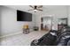 Entertain in this living room featuring tile floors, a leather sofa and large TV at 216 Deer Trace Circle, Myrtle Beach, SC 29588