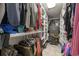 Well-organized walk-in closet featuring custom shelving and a secure Browning gun safe for added security at 216 Deer Trace Circle, Myrtle Beach, SC 29588