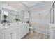 Bathroom featuring double sink vanity, tile floors, and a glass-enclosed shower at 2504 Heritage Loop # 2504, Myrtle Beach, SC 29577
