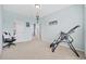 Bright and airy bedroom with neutral walls, doorway to bathroom and various fitness equipment at 2504 Heritage Loop # 2504, Myrtle Beach, SC 29577